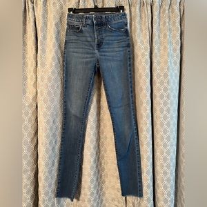 LC Lauren Conrad ankle skinny jeans with raw hem and exposed button fly.